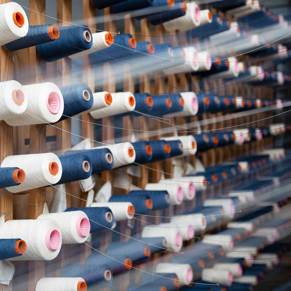 Bobine de fil pour le tissage d'un tissu denim Dao en France